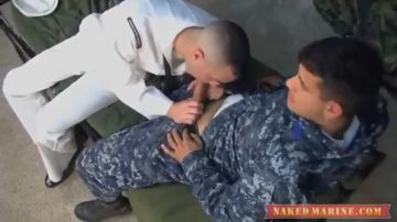 Two men in different uniforms give blowjobs
