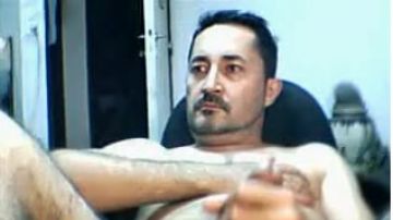 South American man jerks off in front of a webcam