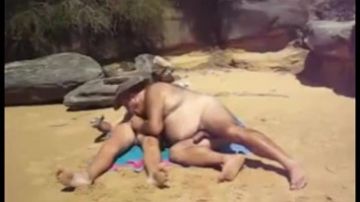 Two men spread blanket on the beach and fuck each other